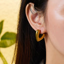 Wholesale Stainless Steel Golden Earrings for Women - European and American - style Light Luxury Titanium Steel Twisted C - shaped Ear Hoops