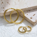 Brand X Retro Gold Titanium Steel Earrings, Embossed Circle Hoops, Minimalist Stylish Fade-Resistant Ear Cuffs for Women